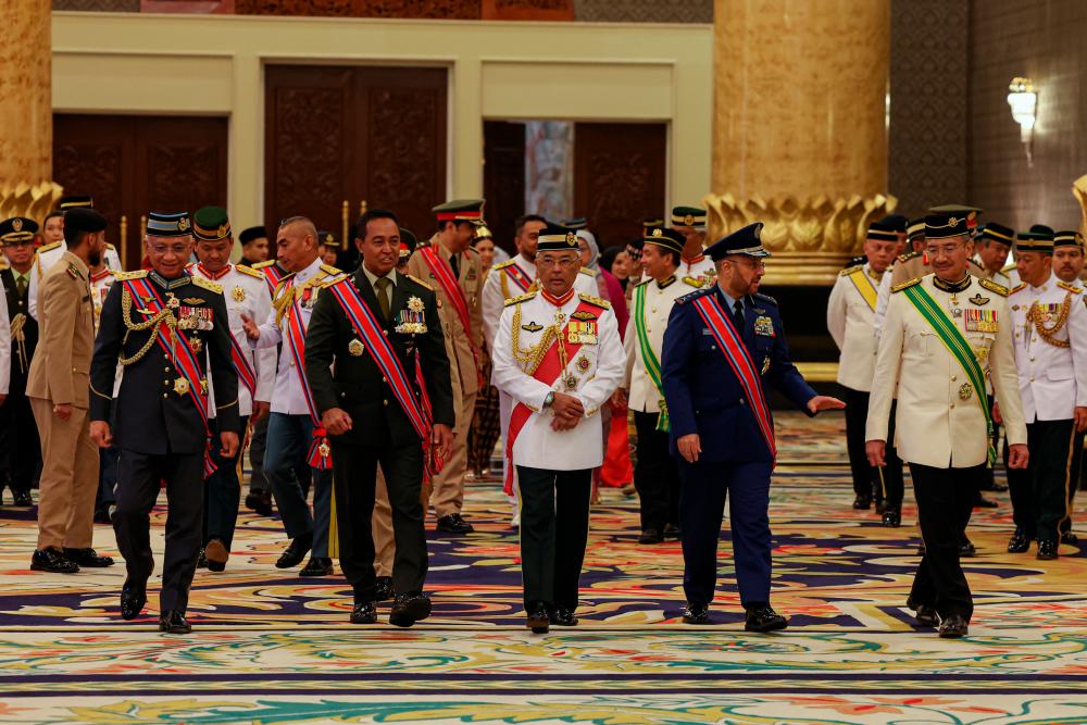 KUALA LUMPUR, Oct 18 -- Yang di-Pertuan Agong Al-Sultan Abdullah Ri’ayatuddin Al-Mustafa Billah Shah (centre) with the Heroic Degree recipients heading to the Dinner Ceremony after the completion of the Malaysian Armed Forces Heroic Degree Awarding Ceremony (DKAT) 2022 session first at Istana Negara today. BERNAMAPIX