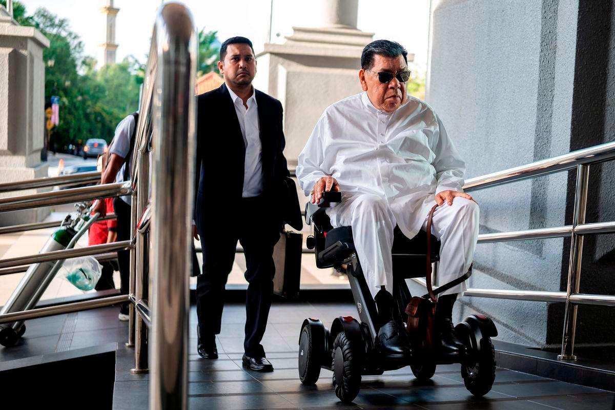 Abu Sahid making an appearance at court in a motorised wheelchair. – BERNAMAPIC