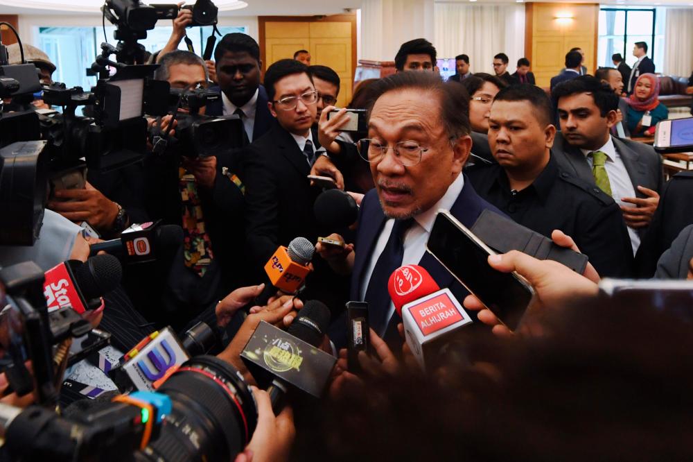 Port Dickson MP Datuk Seri Anwar Ibrahim speaks to the media at Parliament today. - Bernama