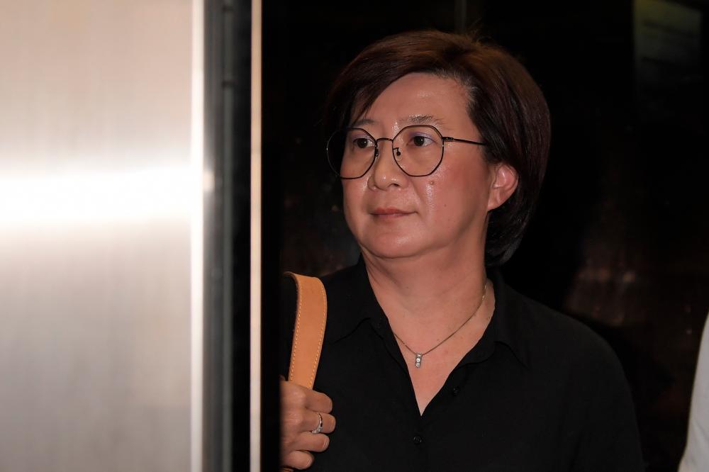 Fang Suat Lim, 49, the manager of the Allianz General Insurance branch at Wisma Allianz, Jalan Gereja, Kuala Lumpur, appears at the Kuala Lumpur Court Complex today. - Bernama
