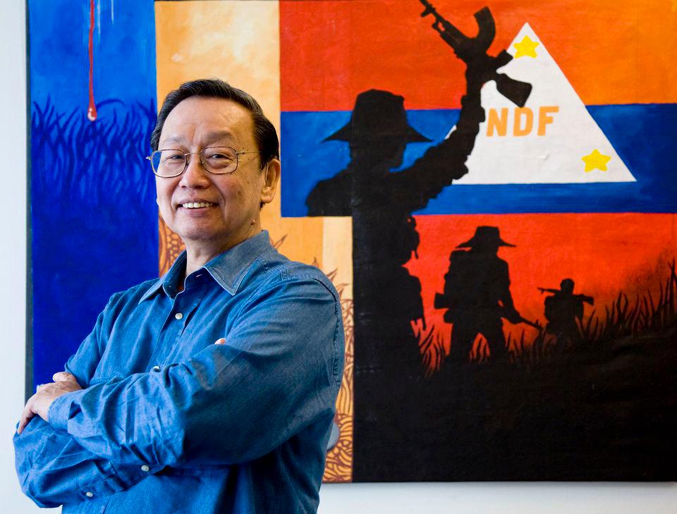 Philippines communist party founder Jose Maria Sison, 68, poses in front of a poster of the National Democratic Front (NDF), the political arm of the Maoist rebels, in Utrecht July 16, 2007. REUTERSPIX
