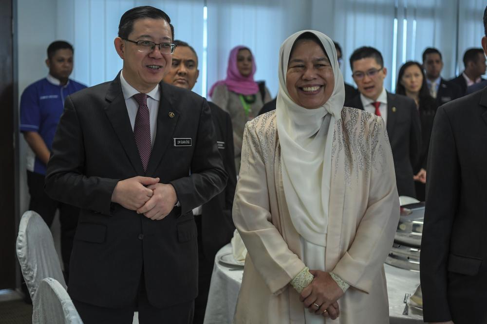 Finance Minister Lim Guan Eng and Housing and Local Government Minister Zuraida Kamaruddin attend the Meeting with PKP at the Temporary Parliament Building yesterday. - Bernama