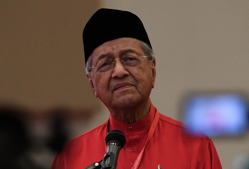 Prime Minister Tun Dr Mahathir Mohamad, who is also Bersatu chairman, gives his opening speech at Bersatu’s extraordinary general meeting at Maeps, Serdang today. - Bernama