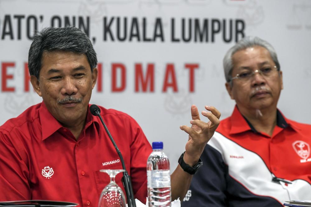 Acting Umno president Datuk Seri Mohamad Hasan (L) speaks during a press conference after chairing the Umno Supreme Council Meeting at Putra World Trade Centre (PWTC), on Jan 9, 2018. — Bernama
