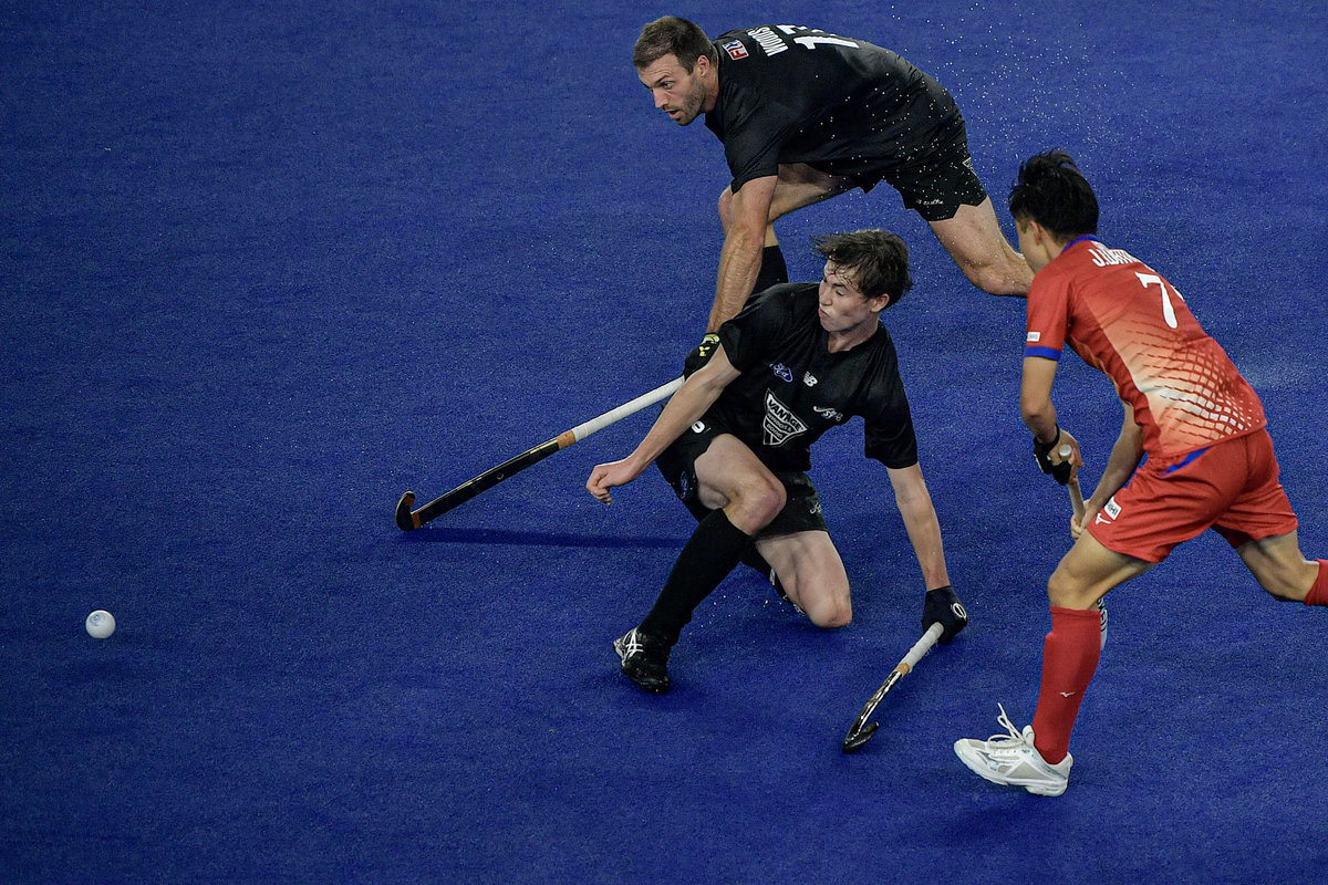 Japan team player Watanabe Jun (right) gets past New Zealand team player Morrison Charlie in a Group B match of the 2024-25 FIH Hockey Nations Cup at the Bukit Jalil National Hockey Stadium. - BERNAMApix