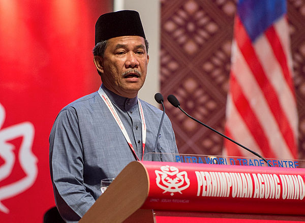 Umno deputy president Datuk Seri Mohamad Hasan speaking at the 2019 Umno general assembly at the Putra World Trade Centre yesterday. — Bernama
