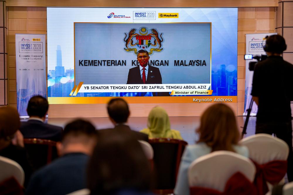Finance Minister Tengku Datuk Seri Zafrul Tengku Abdul Aziz delivers his keynote address during Invest Malaysia 2020 at Bursa Malaysia today. - Bernama