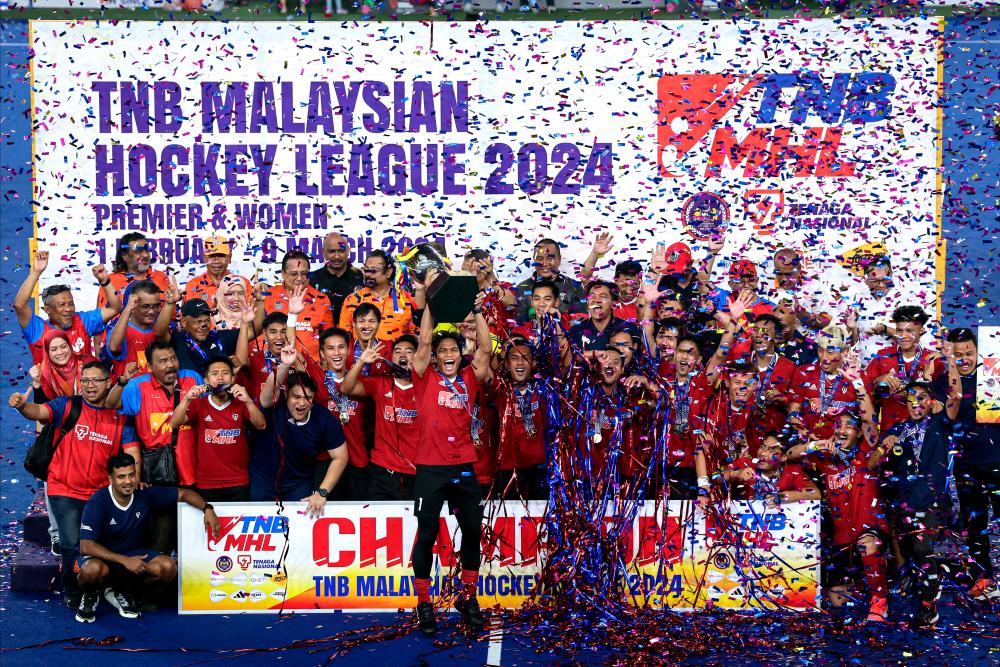 The TNB team celebrated their victory after winning the TNB Cup Hockey Tournament at the Bukit Jalil National Hockey Stadium today. - BERNAMApix