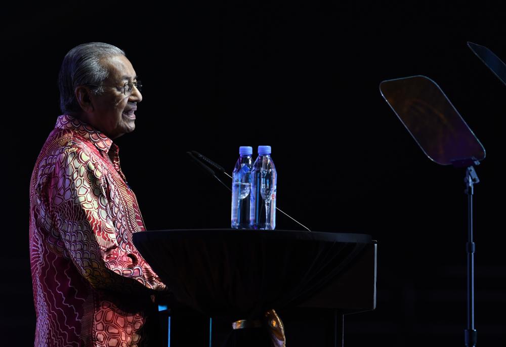 Prime Minister Tun Dr Mahathir Mohamad speaks during the ‘My Voice My Nation Malaysia 2019’ edutainment concert at the Axiata Arena in Bukit Jalil on the night of June 26, 2019. - Bernama