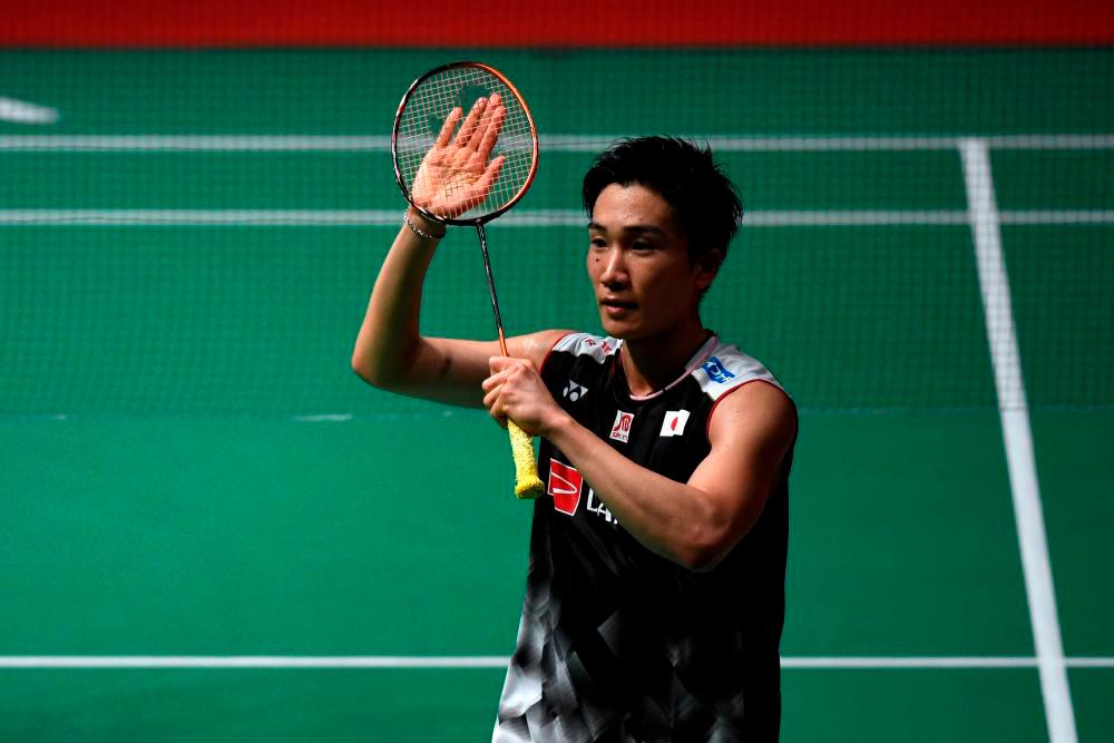 Showboating Momota thrills home fans at badminton worlds