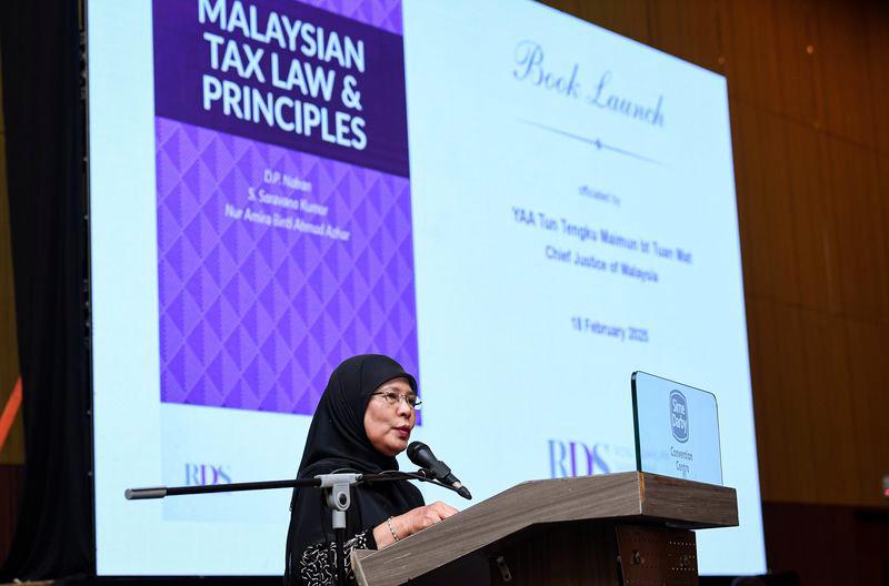 Chief Justice of Malaysia Tun Tengku Maimun Tuan Mat delivers her keynote address during the official launch of Malaysian Tax Law and Principles Book in conjunction with Rosli Dahlan Saravana Partnership (RDS) Legal and Tax Briefing 2025 at the Sime Darby Convention Centre (SDCC) on Tuesday (Feb 18). - BERNAMAPIX