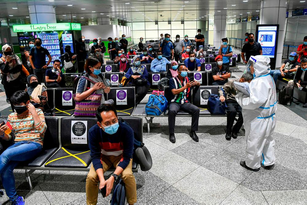 The process yesterday, to be screened for Covid-19 at the KLIA’s arrival hall was organised.-Bernama