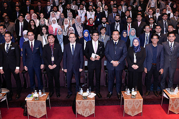 Malaysian Youth and Sports Minister Syed Saddiq Syed Abdul Rahman (centre) posing for a group photo with delegates during the opening of Youth Kuala Lumpur Summit 2019 at the Kuala Lumpur Convention Centre on Dec 17. — Bernama