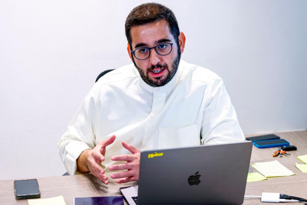 Managing editor of Kuwait-based digital magazine “Manshoor” Mohammad Almutawa, speaks during an interview at his office in Kuwait City on July 26, 2023. AFPPIX