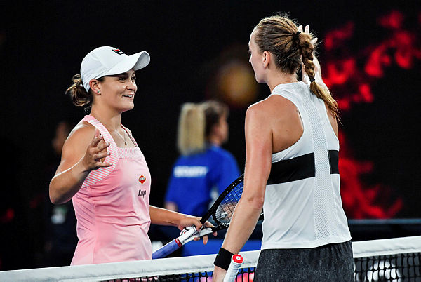 Czech Republic’s Petra Kvitova (R) shakes hands with Australia’s Ashleigh Barty during their women’s singles quarter-final match on day nine of the Australian Open. — AFP