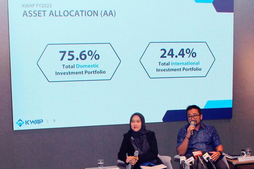 Nik Amlizan (left) and Hazman during a question-and-answer session at KWAP's 2023 financial results announcement today. – Bernamapic