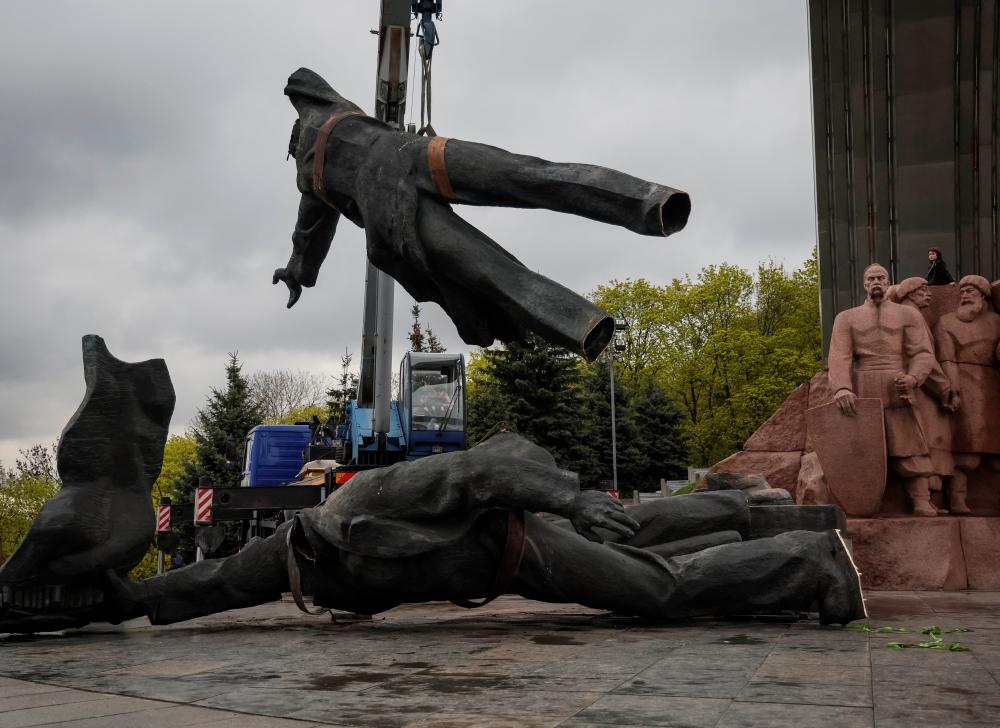 A Soviet monument to a friendship between Ukrainian and Russian nations is seen during its demolition, amid Russia's invasion of Ukraine, in central Kyiv, Ukraine April 26, 2022. REUTERSpix