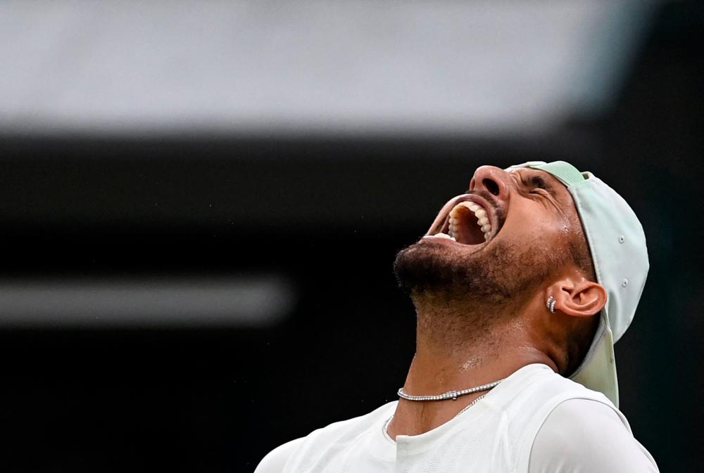 Australia's Nick Kyrgios celebrates beating Greece's Stefanos Tsitsipas during their men's singles tennis match on the sixth day of the 2022 Wimbledon Championships at The All England Tennis Club in Wimbledon, southwest London, on July 2, 2022. AFPPIX