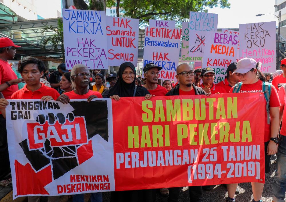 A group demanding better treatment for workers and increase in minimum wage march during a peacful assembly, at the city centre, on May 1, 2019. — Sunpix by Asyraf Rasid