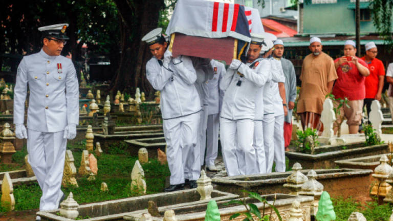 The body of Muhammad Lailatulman Mohd Sukri, 26, arrived to be buried in military ceremonies at the Rantau Panjang Islamic Cemetery on Oct 1, 2017. — Bernama