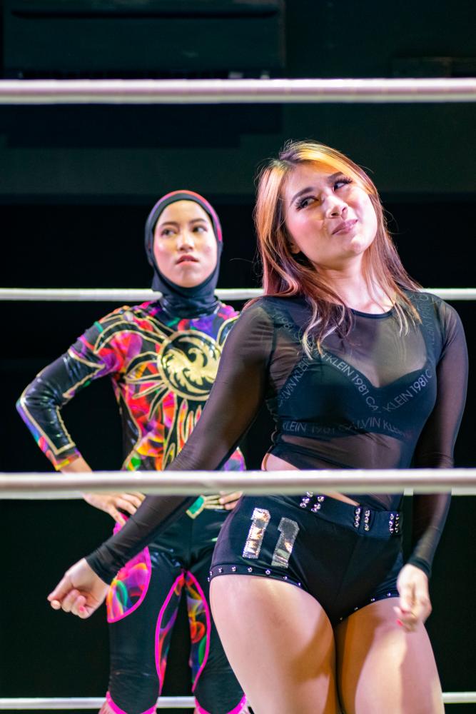 $!Phoenix and Poppy in one of their matches at APAC — Pic courtesy of APAC Wrestling