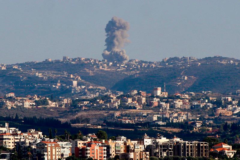 Smoke rises during Israeli strikes on villages overlooking the souther Lebanese city of Tyre on October 11, 2024. Lebanon urged the UN on October 11 to demand an “immediate” ceasefire between Israel and Hezbollah, nearly three weeks into a war that has killed 1,200 people and displaced more than a million others. - KAWNAT HAJU / AFP