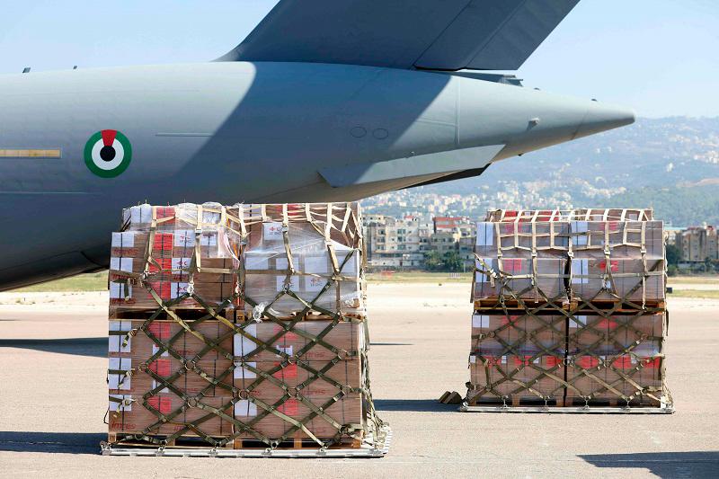 Airport workers transport humanitarian aid, provided by the UAE, at Lebanon’s Beirut international airport on October 5, 2024. - AFPpix