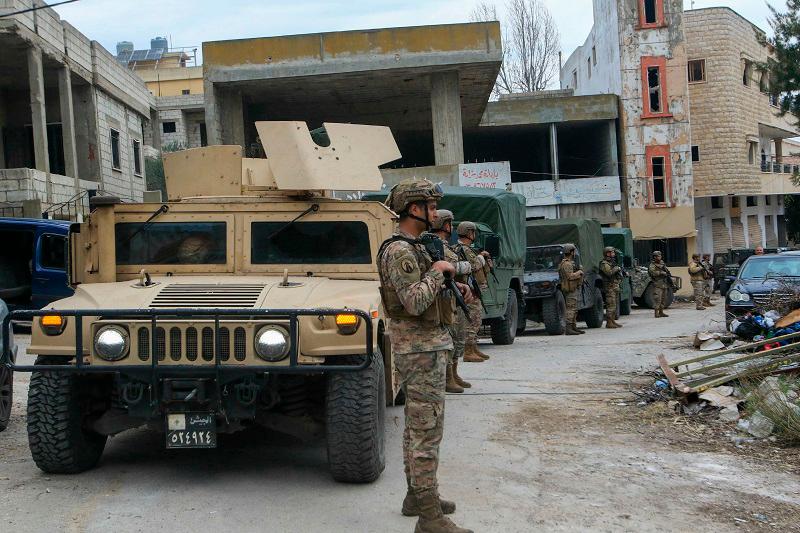 Lebanese soldiers set up a checkpoint to turn back displaced residents attempting to return to their homes at the entrance of the southern Lebanese village of Aitaroun on January 26, 2025, on the day Israel was meant to withdraw under a truce deal. Israeli army fire killed 15 people in south Lebanon including a soldier on January 26, health officials said, as residents tried to return home on the day Israel was meant to withdraw as part of a ceasefire agreement that ended Israel’s war with the Hezbollah two months ago, which has left the Lebanese militant group weakened. - Mahmoud ZAYYAT / AFP