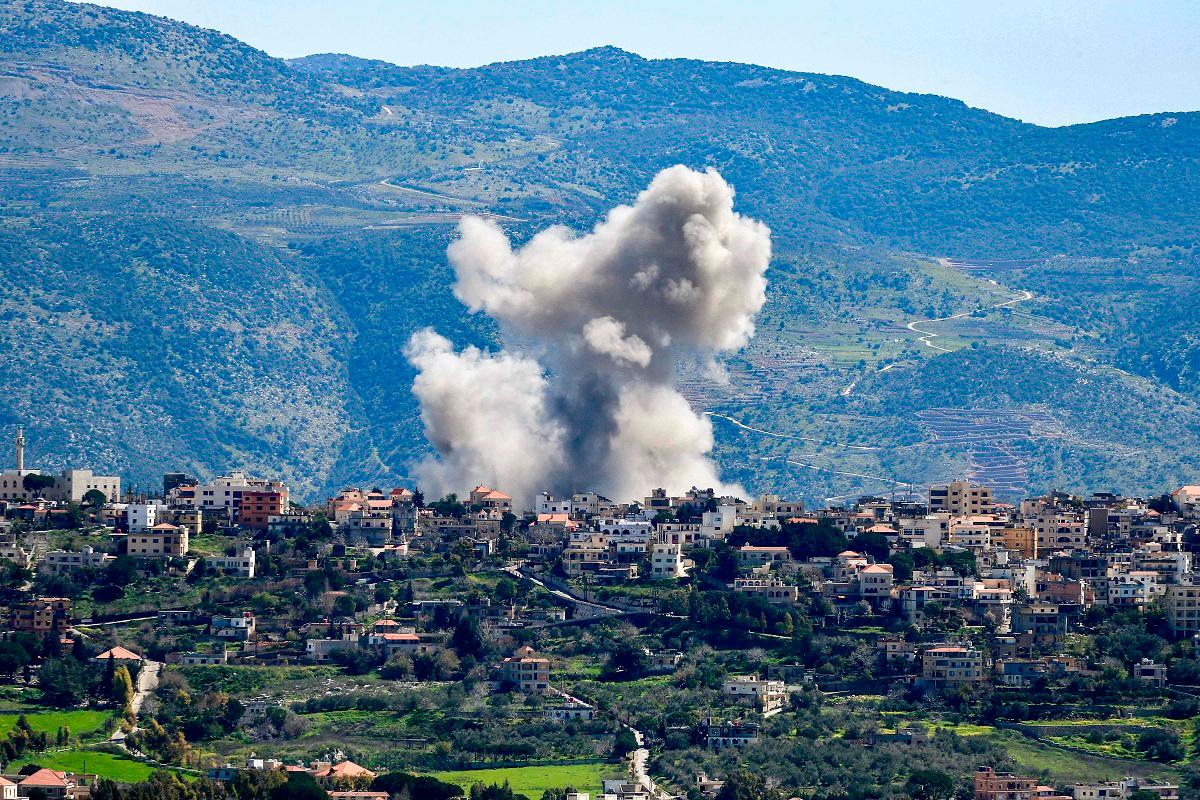 Smoke billows from the site of an Israeli airstrike that targeted the southern Lebanese village of Khiyam on March 12, 2024 amid ongoing cross-border tensions as fighting continues between Israel and Palestinian Hamas militants in the Gaza Strip. - AFP