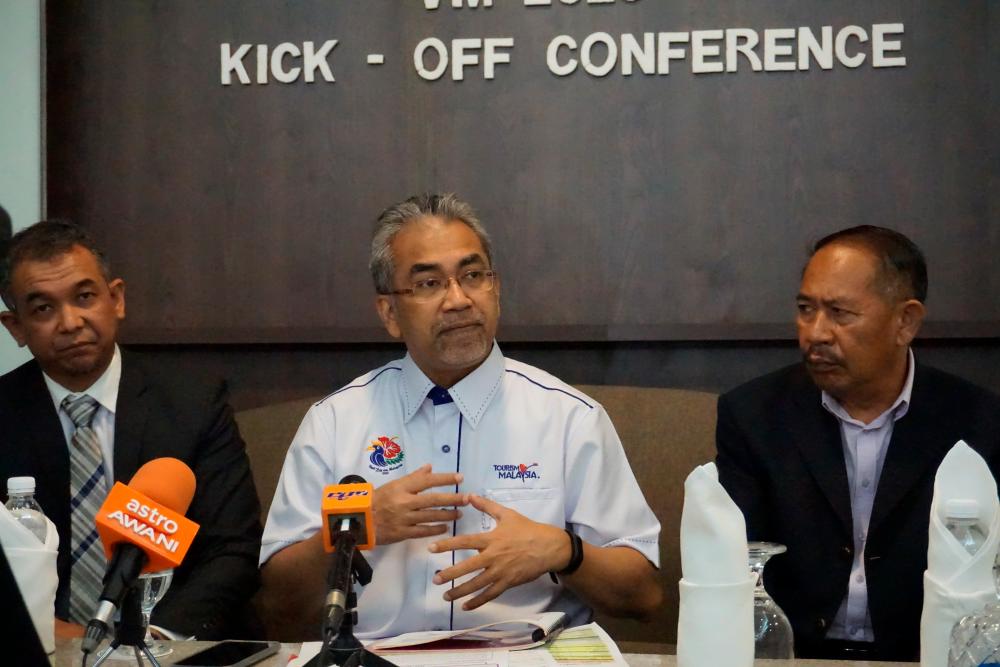 Tourism Malaysia director-general Datuk Musa Yusof (C) speaks to reporters during a press conference at the launch of the Visit Malaysia (VMY) 2020 Kick Off conference in George Town today. - Bernama