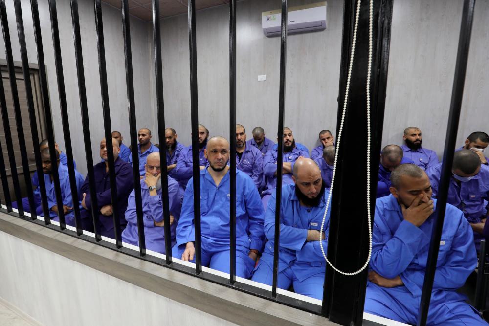 Jihadists accused of being members of the Islamic State (IS) group sit in the defendant booth during their trial, in the northwestern Libyan city of Misrata on May 29, 2023/AFPPix