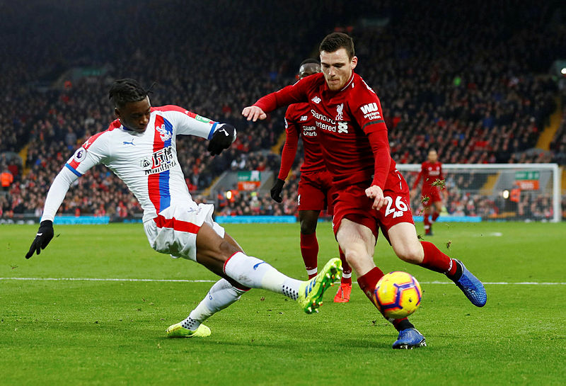 Liverpool’s Andrew Robertson is tackled by Crystal Palace’s Aaron Wan-Bissaka. — AFP