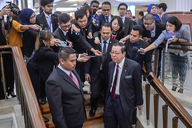 Finance Minister Lim Guan Eng speaks to reporters at the Parliament, on March 12, 2019. — Sunpix by Adib Rawi Yahya