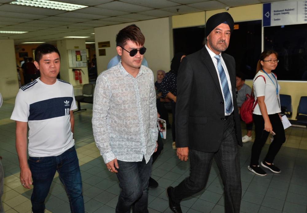 Businessman Datuk Seri Liow Soon Hee (2nd from L) and his defence lawyer, Datuk Seri Rajpal Singh leave the courtroom at the Ampang magistrate’s court on May 10, 2019. - Sunpix