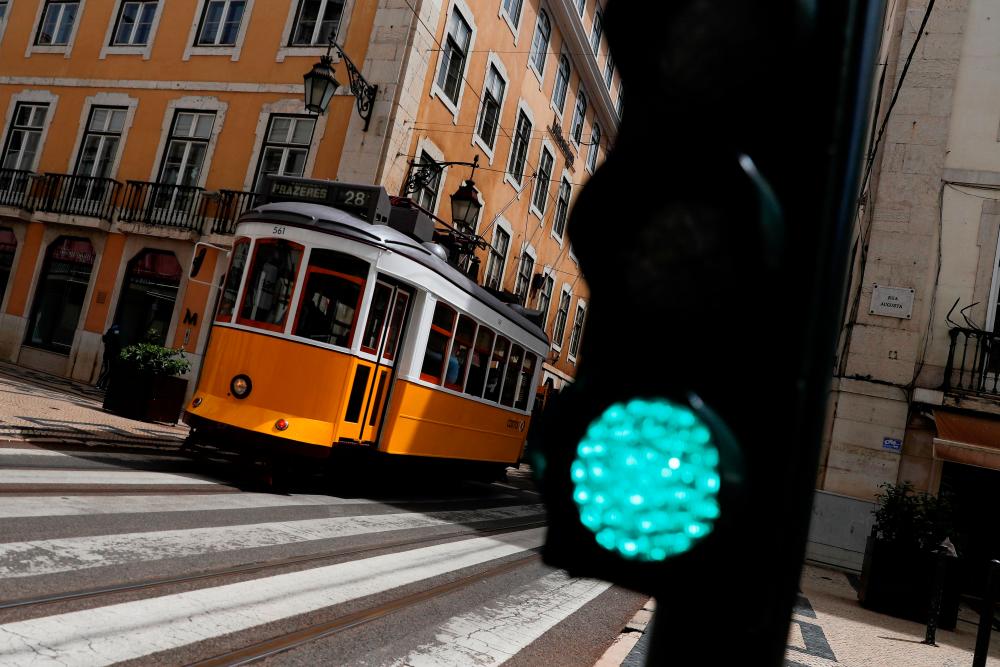 FILE PHOTO: A tram is seen amid the coronavirus pandemic in downtown Lisbon, Portugal, May 11, 2021. — Reuters