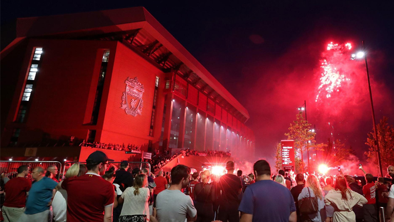 Liverpool fans celebrating title urged to return home