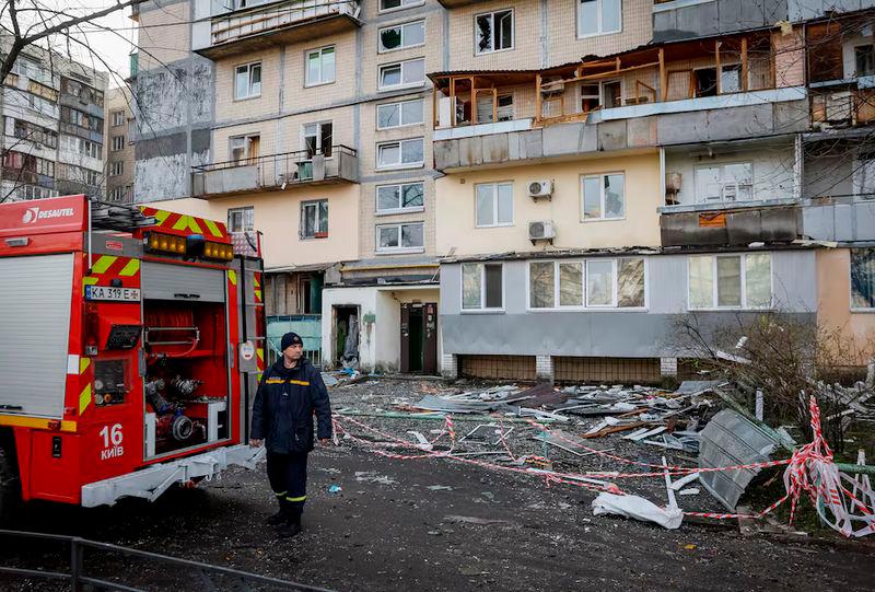 A firefighter works at a site of an apartment building hit by a Russian drone strike, amid Russia’s attack on Ukraine, in Kyiv - REUTERSpix