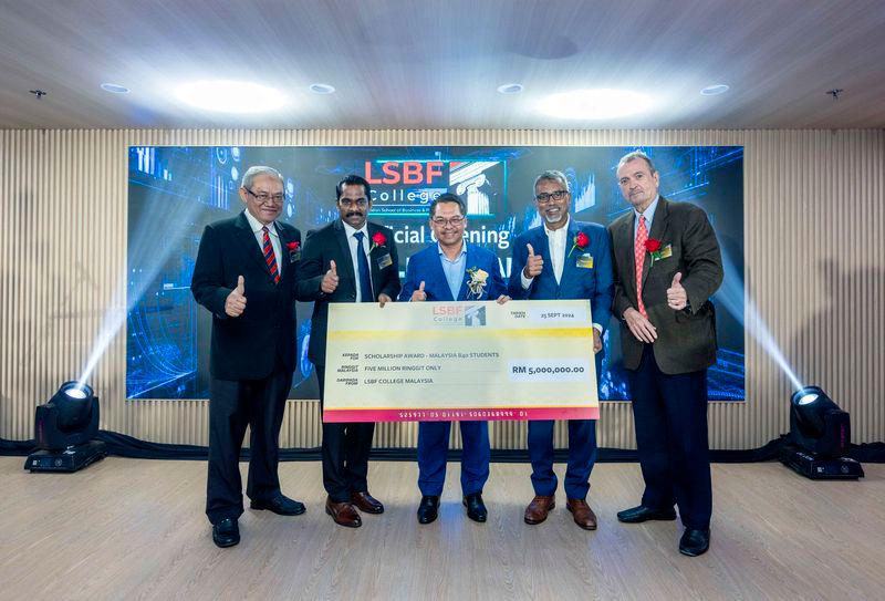 (From left) LSBF College Malaysia Director of Governance and Leadership Tan Sri Ghauth Jasmon, LSBF College Malaysia Director Dr Sajilal Divakaran, Deputy Higher Education Minister Mustapha, LSBF Global CEO, Rathkrishnan Govind and LSBF Global Chairman Alan Diaz, with a mock scholarship cheque of RM5 million at the launch of LSBF in KL.