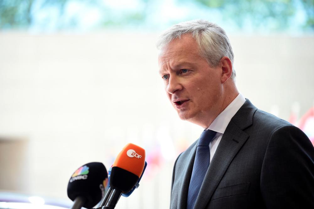 French Finance Minister Bruno Le Maire answers journalists during Eurogroup meeting at the EU headquarters in Luxembourg on June 13, 2019. — AFP
