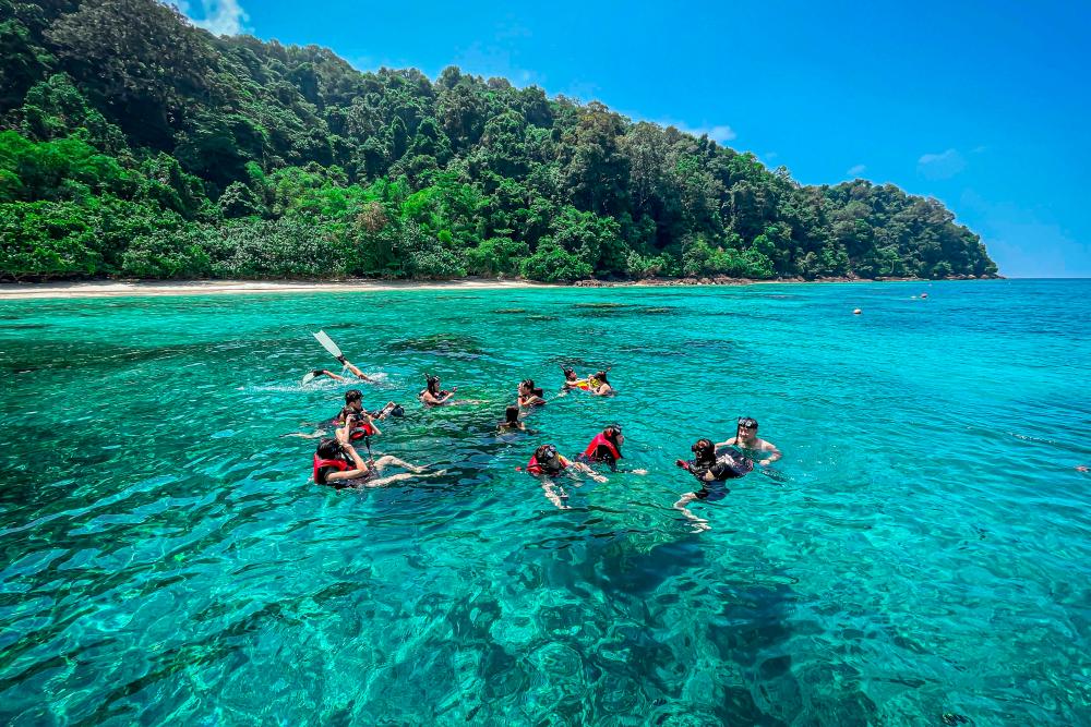 $!Snorkelling is one of the most popular activities on this tropical paradise.