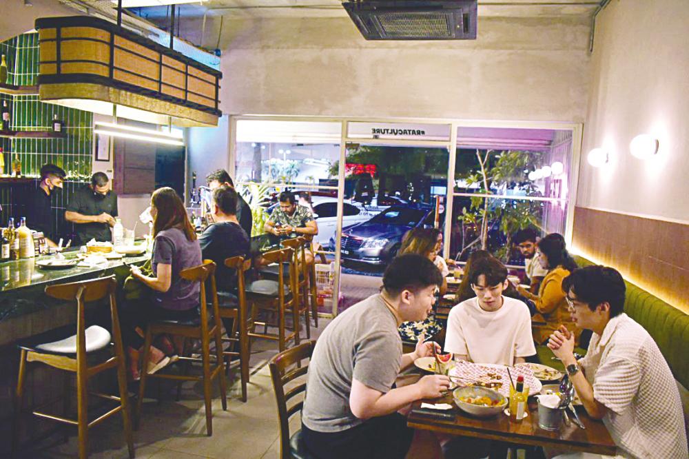 Customers savouring the fantastic food. $!Customers savouring the fantastic food.
