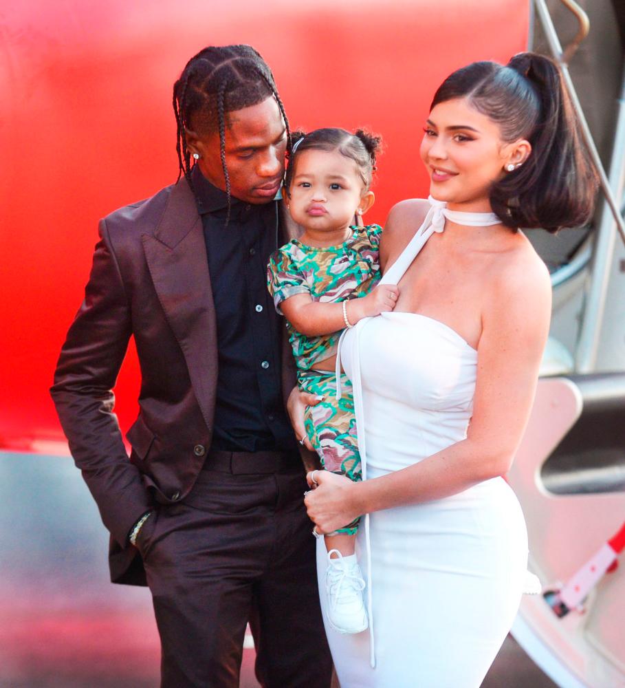 Travis Scott and Kylie together with daughter Stormi at an event last year. – Shutterstock