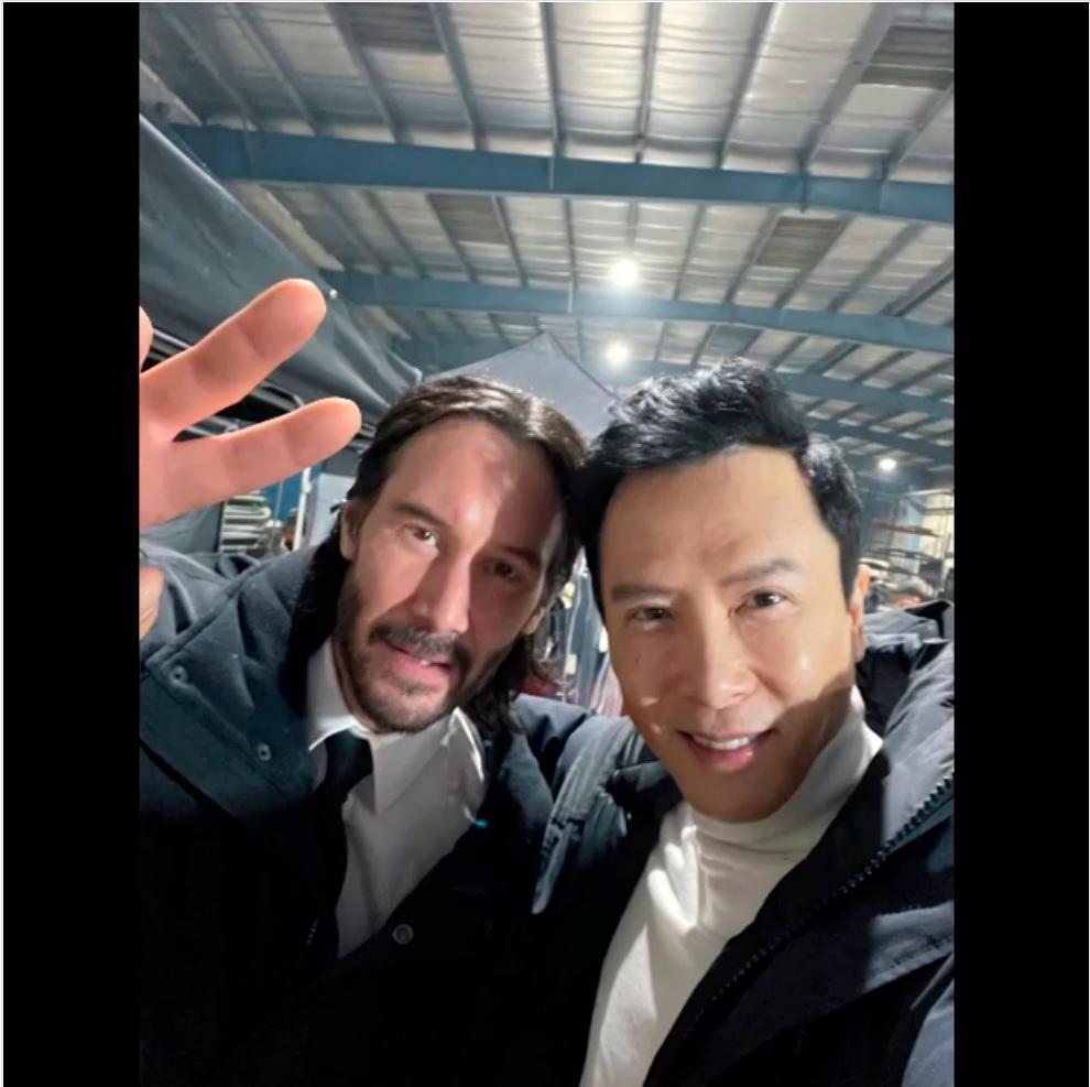 A screenshot from Yen’s video showing him and Reeves on set.