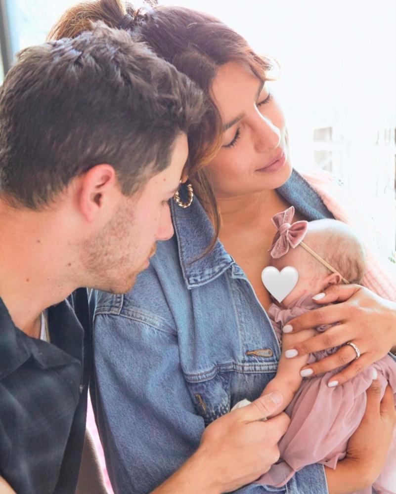 Jonas and Chopra with their baby girl. – Instagram