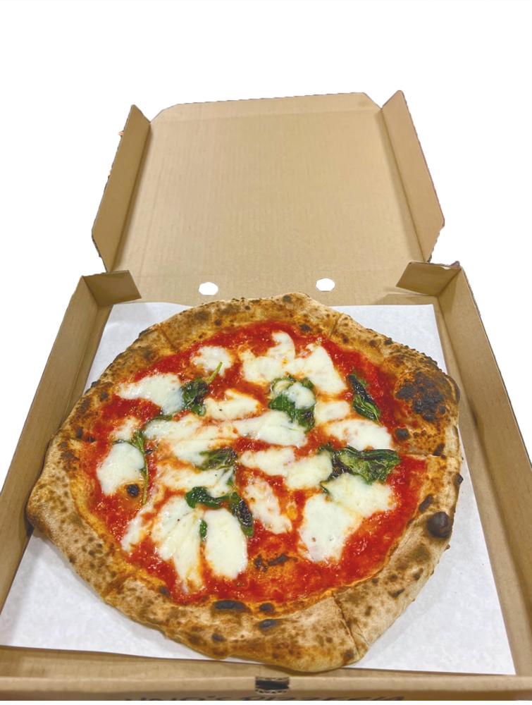 $!Delicious Margherita pizza served in a box.