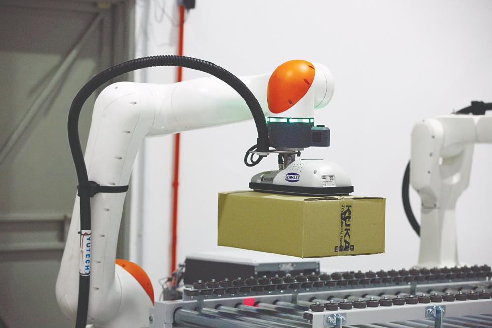 $!The robots and cobots are able to work in tandem, similar but also faster than traditional human workforce.