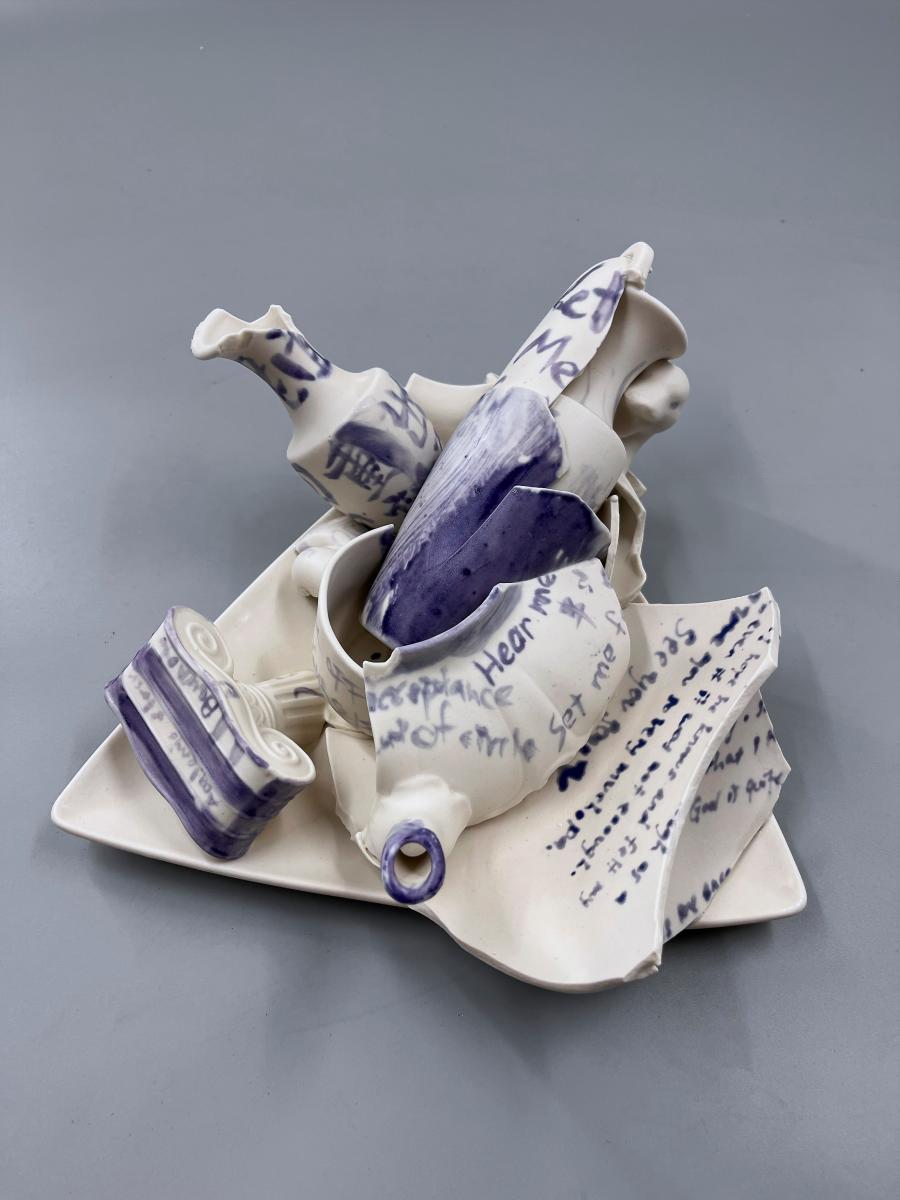 Broken pieces of clay with the written thoughts of a participant. $!Broken pieces of clay with the written thoughts of a participant.