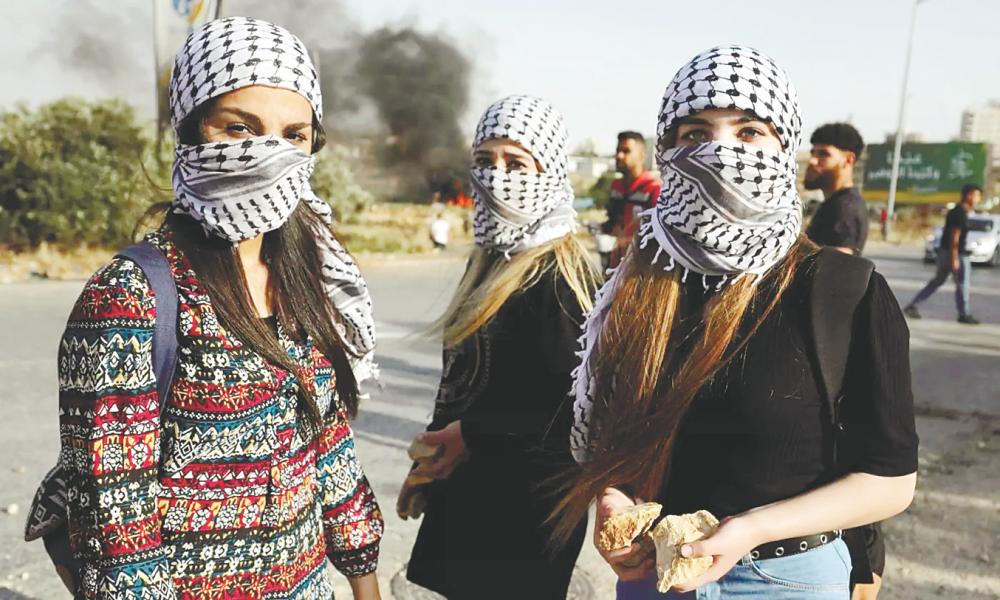 Keffiyeh can also be worn similar to a ‘tactical shemagh’ for anonymity. - AFPPIC