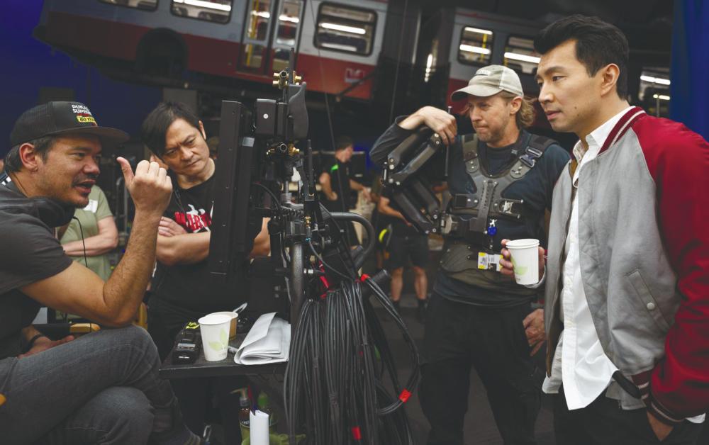 Cretton (far left) made his directorial Marvel debut with Shang-Chi. – DISNEY