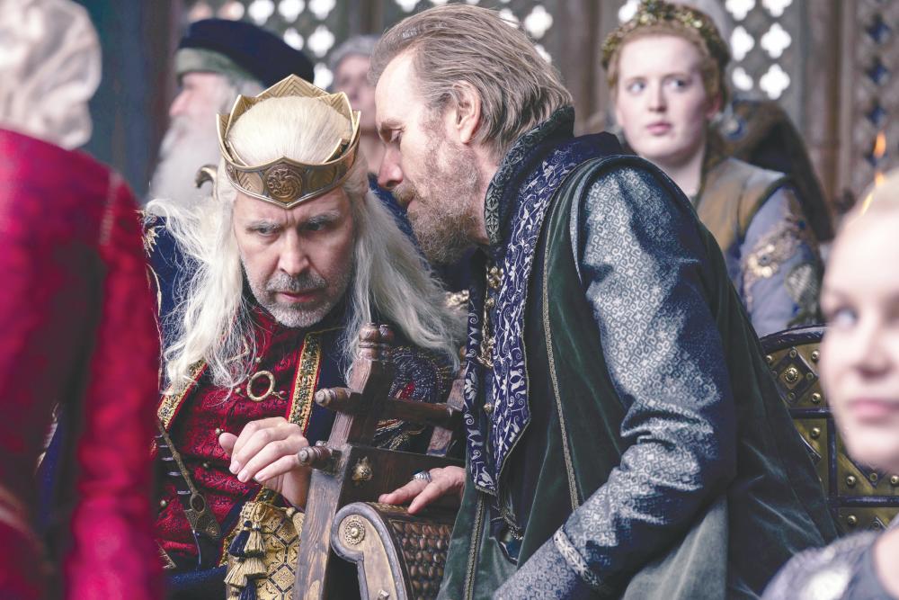 $!Ser Otto Hightower (right) schemes to put himself in the king’s good graces.